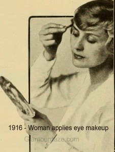 1916 - woman applies eye makeup
