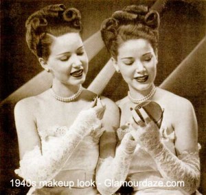 Twins-applying-makeup,-1940s.
