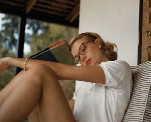 Grace Kelly with some stylish reading glasses - 1956