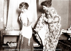 1910---putting-on-a-corset---Minesota-historical-Society