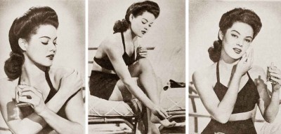 1940s-woman-applies-makeup-on-beach