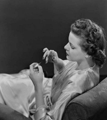 woman-applying-nail-varnish,-taken-by-Photographic-Advertising-Limited,-c.-1950.