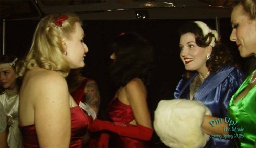 Miss-Emilie-and-Dapper-Dan-Doll-talk-backstage-before-the-1940s-and-‘50s-White-Christmas-Ball-Pin-Up-Contest.-From-Pin-Up!-The-Movie.