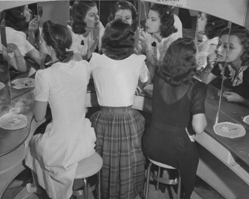 1940s-Fashion-Forecast---models-make-up-at-dressing-table