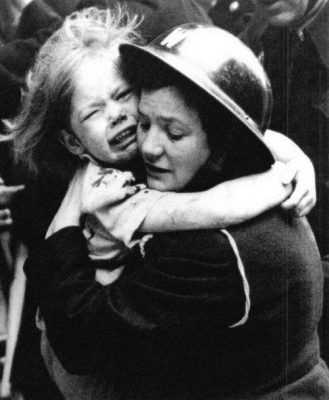 air-raid-warden-rescues-little-girl-during-bombing-raid-in-London
