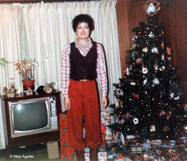 Christmas 1981. Woman by Christmas tree