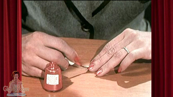 1950's woman applies nail polish