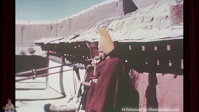Tibetan Lama blows his horn at Gyantse