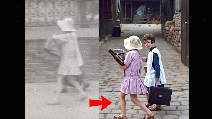 Paris in 1930s. Two schoolchildren walking on a cobble stoned footpath.